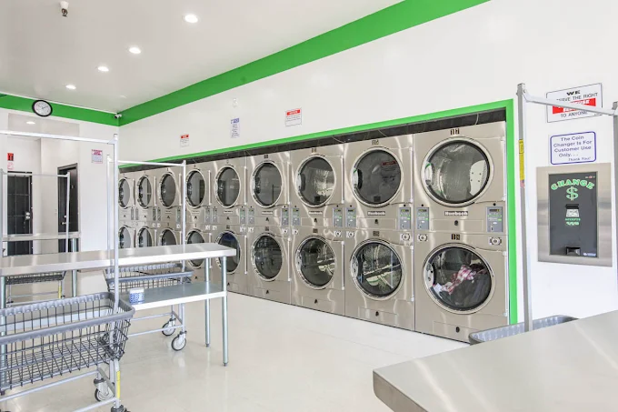 Wide shot of dryer bank and change machine
